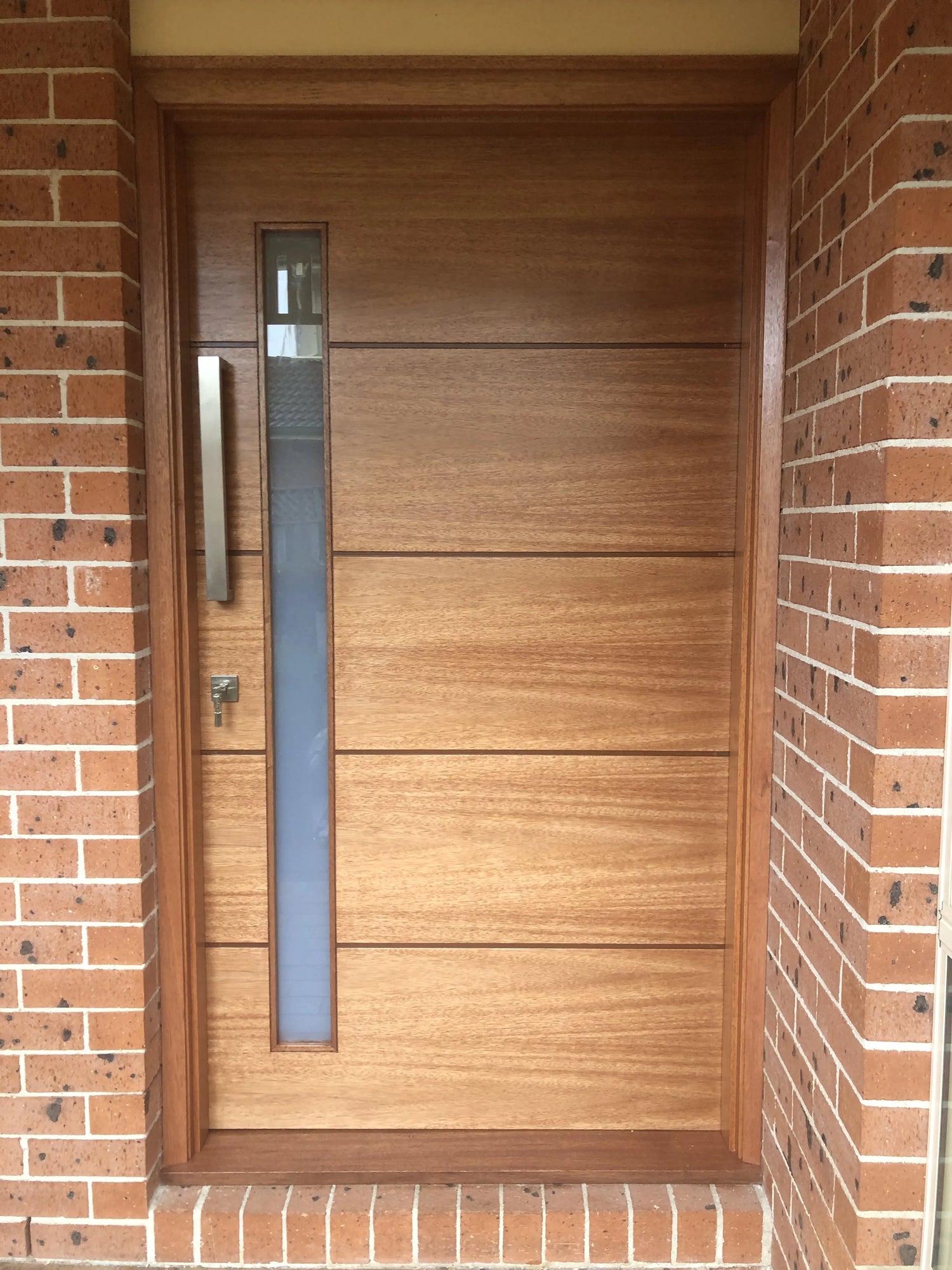 External Door with clear varnish finish installed in Menai