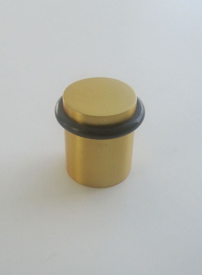 Gold door stopper fixed on floor