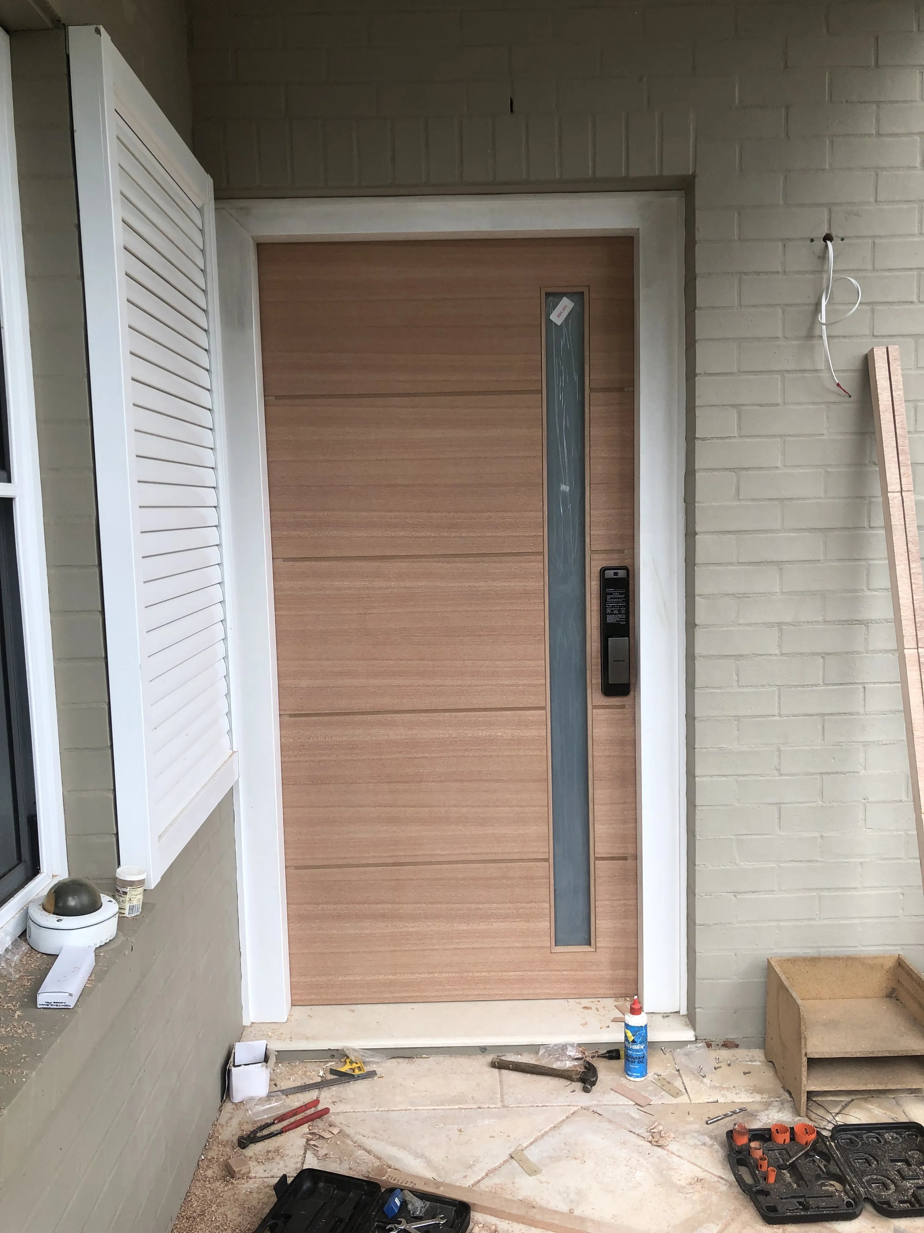 1LG 2340x1100x40mm entrance door installed in Sydney, Australia. Samsung electronic lock installed.