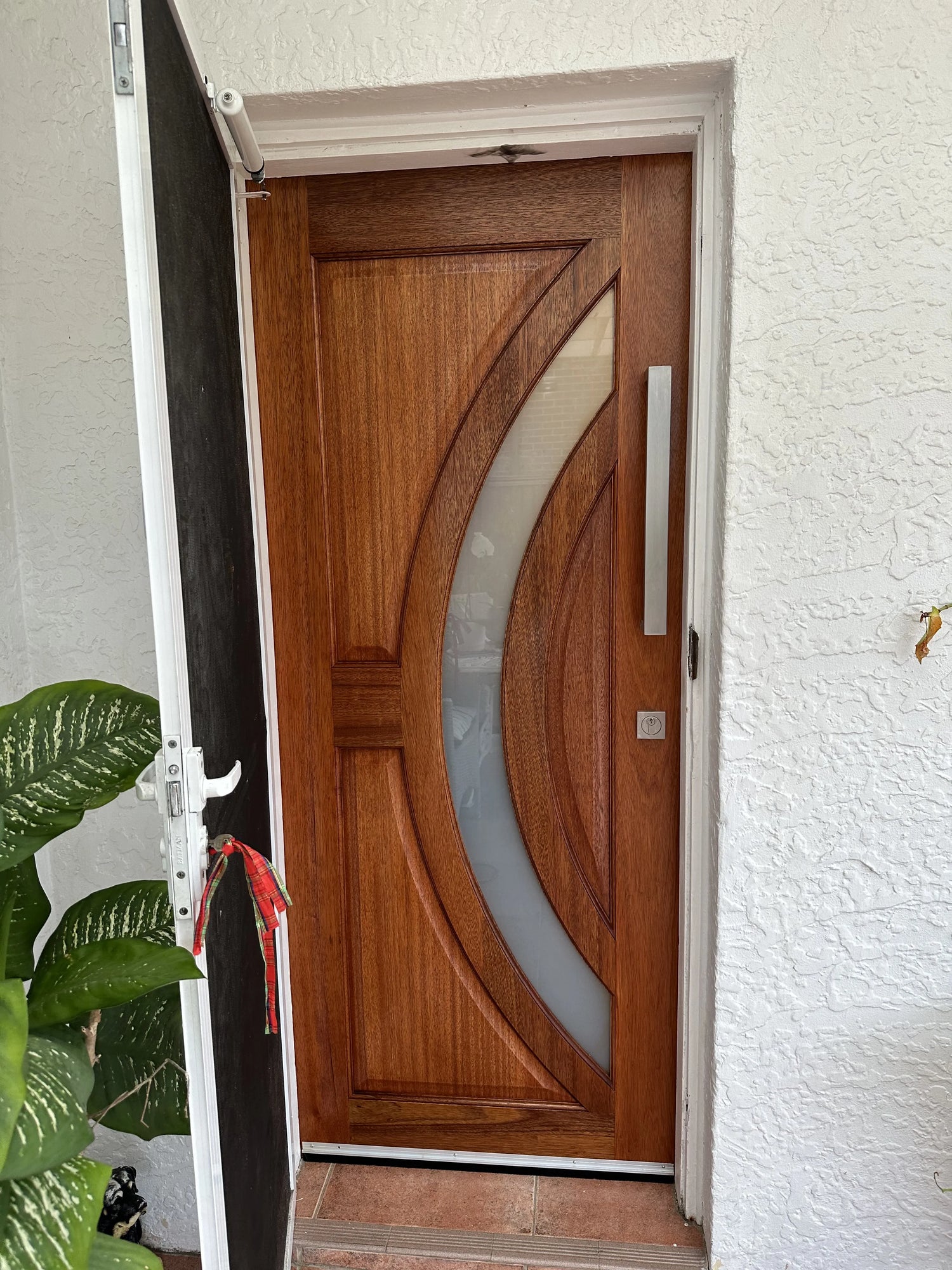 Stained joinery door with curved frosted glass installed in Sydney with mortice lock and pull handle.