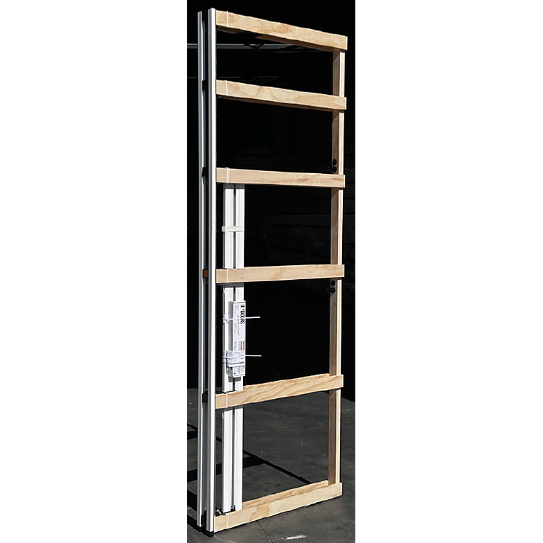 Cavity door unit standing with its slide track and box of fittings attached.