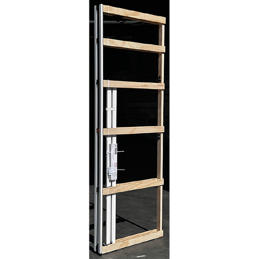 Cavity door unit standing with its slide track and box of fittings attached.